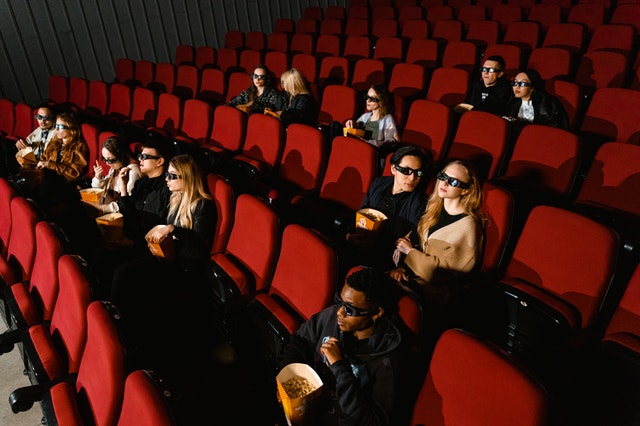 Guys at cinema with 3D glasses